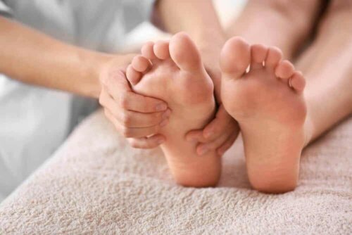 A person massaging someone's feet.