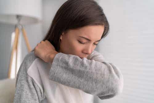 A woman coughing.