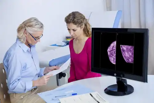 A doctor interpreting the results of a mammogram.