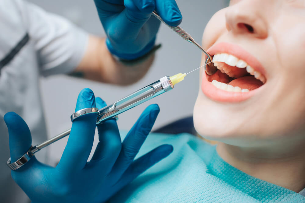 A woman in the dentist.