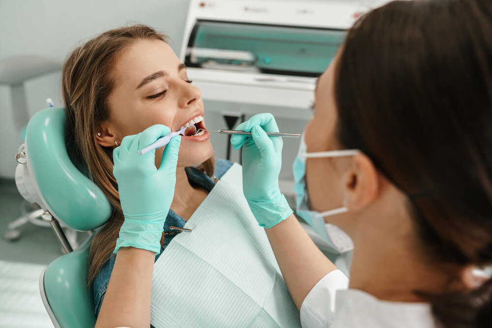 A woman in the dentist.